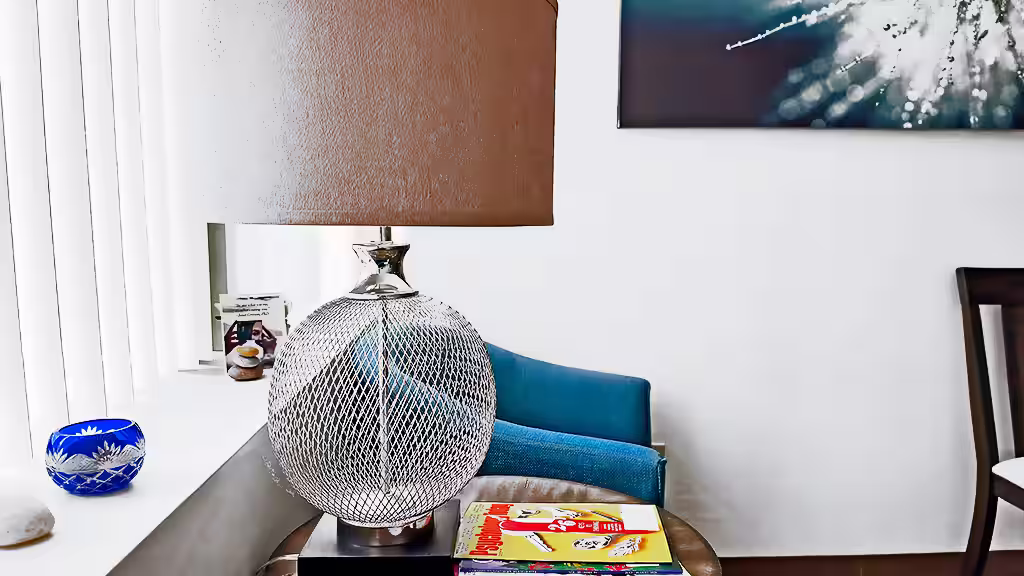 Lamp, chairs, and decorations by waiting room window